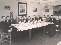 Richard enjoying a meal with other trainees and a local family in Zlin, 1936.